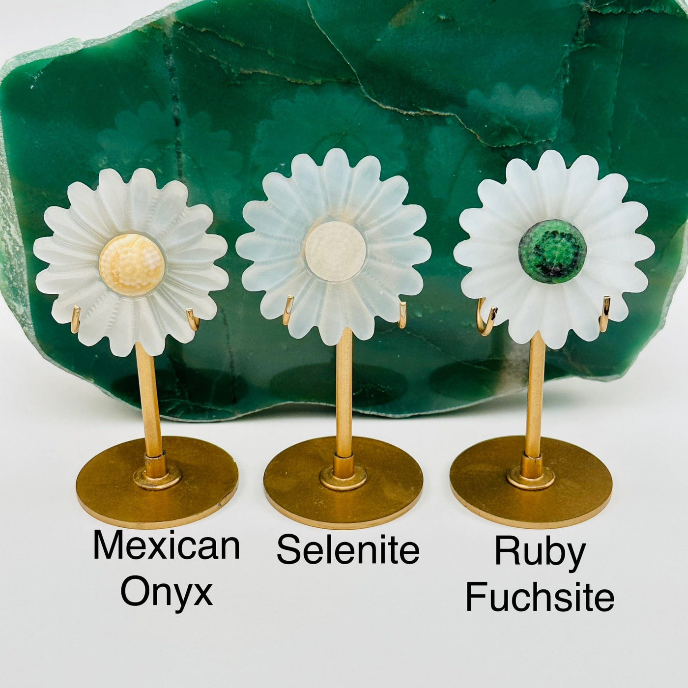 selenite crystal flower displayed next to their gemstone crystal name