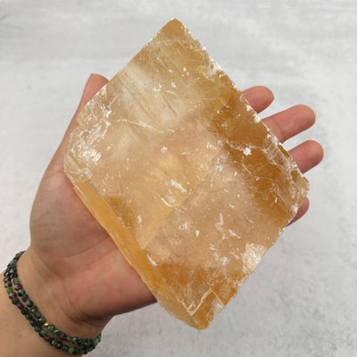 calcite piece in hand for size reference 