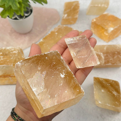 Yellow Optical Calcite in hand for size reference 