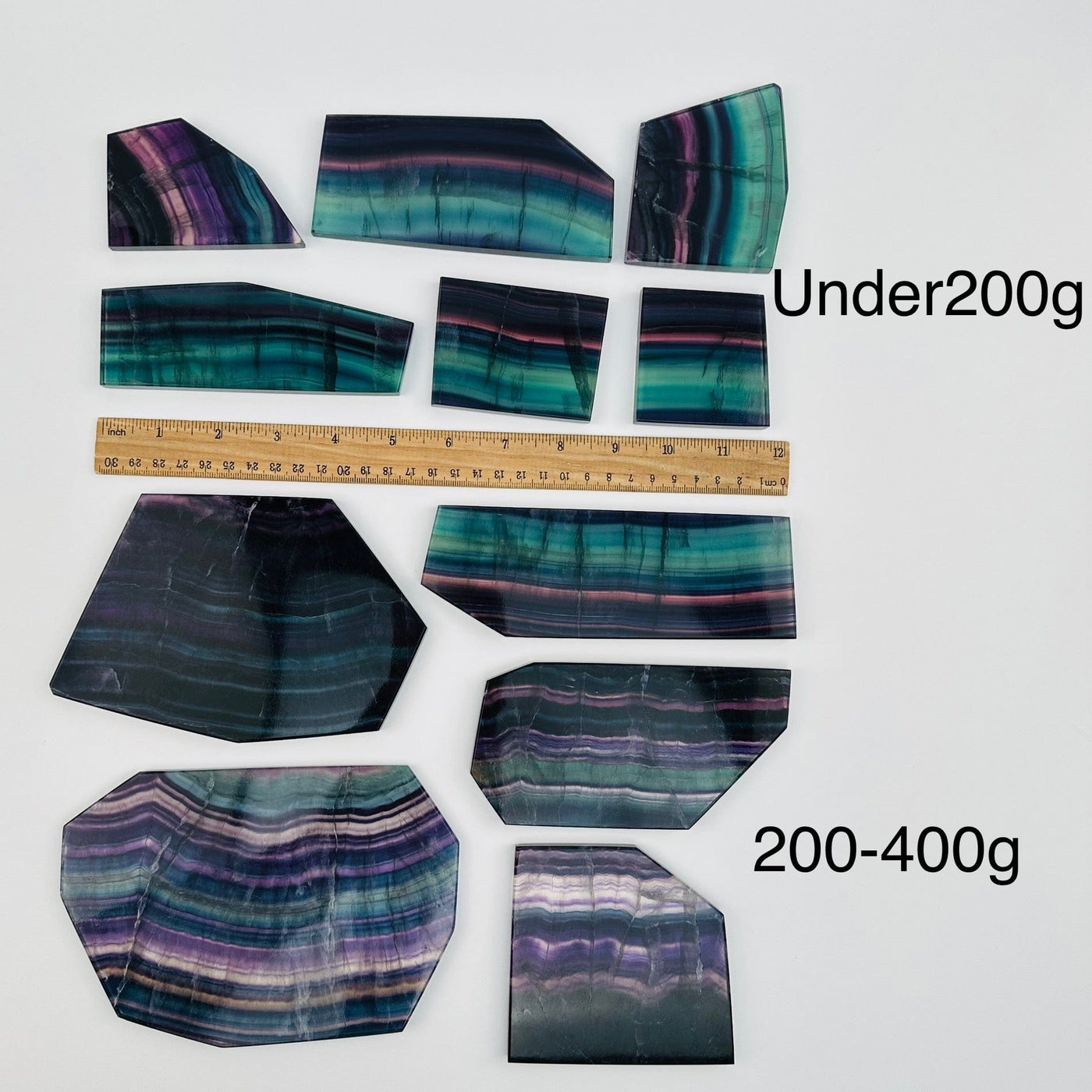fluorite slabs sold by weight. displayed next to a ruler for size reference 