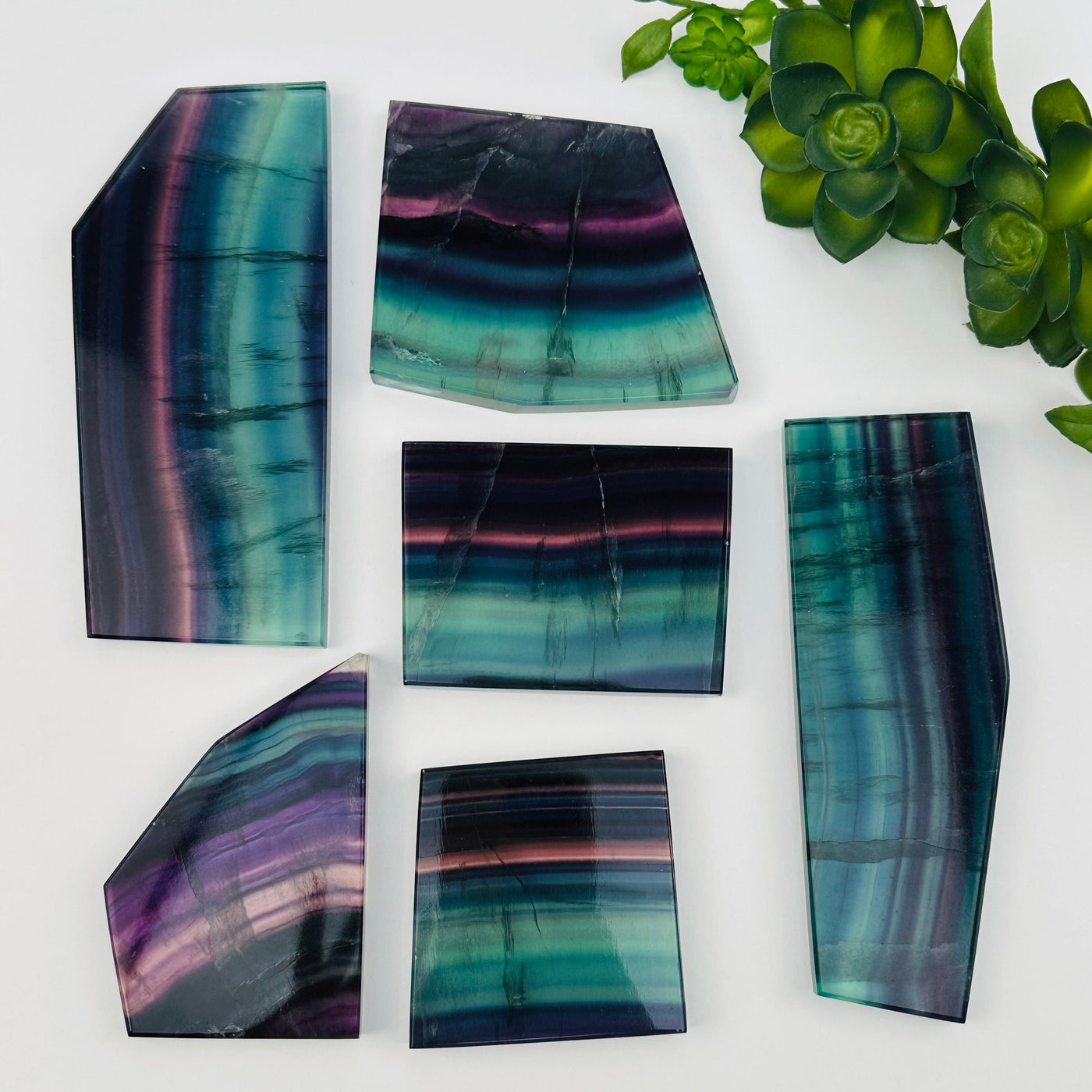 close up of the details on these fluorite crystal slabs to show the different color shades