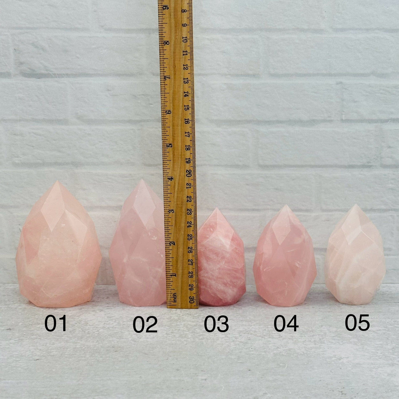 Faceted Rose Quartz Crystal Egg Point - You Choose - next to a ruler for size reference 