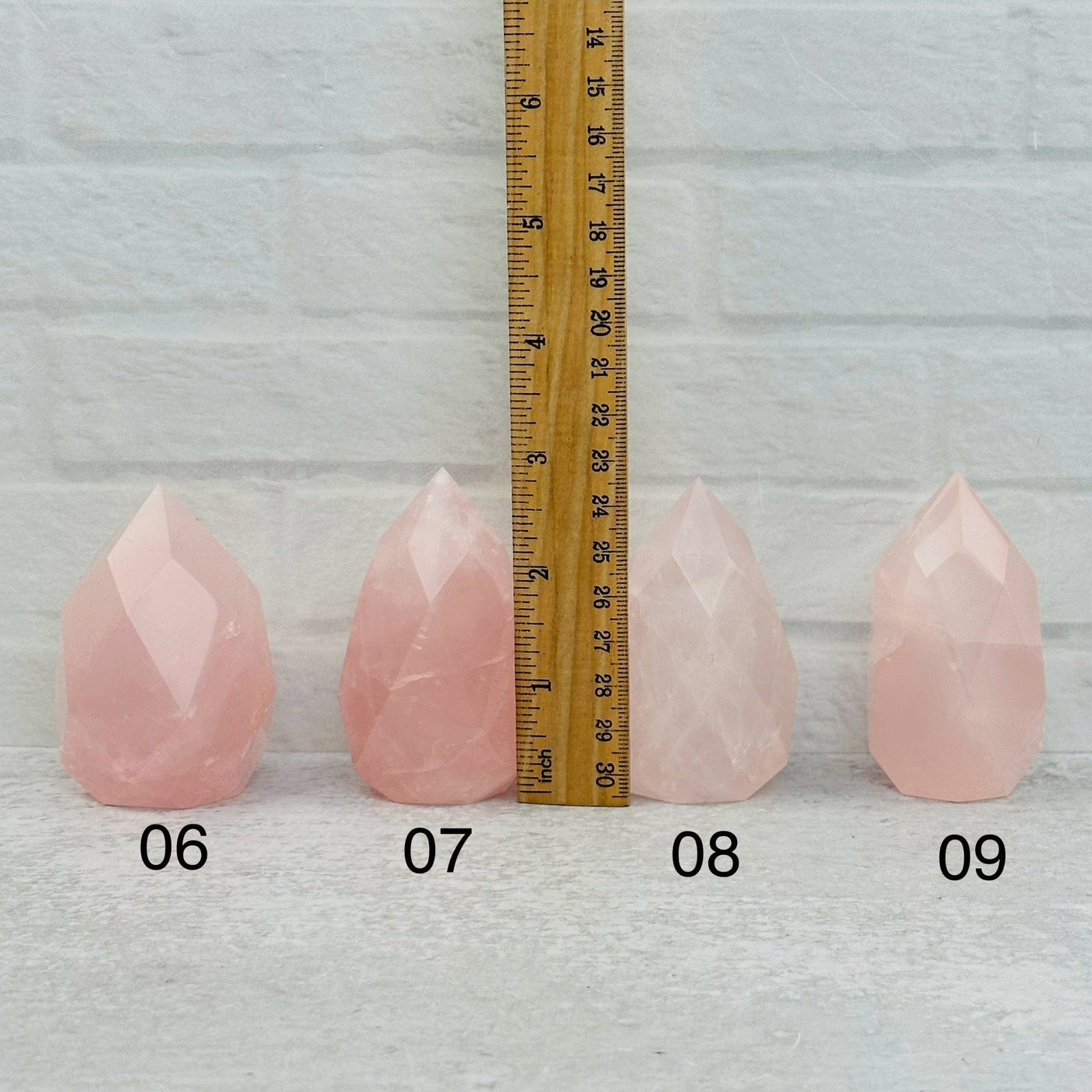 Faceted Rose Quartz Crystal Egg Point - You Choose - next to a ruler for size reference