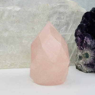 Faceted Rose Quartz Crystal Egg Point displayed as home decor 