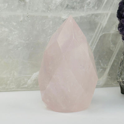 Faceted Rose Quartz Crystal Egg Point displayed as home decor