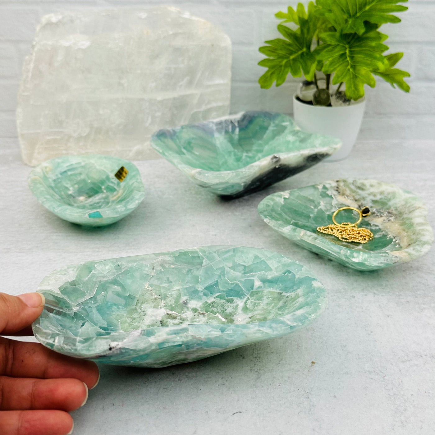 Fluorite Polished Bowl from Mexico next to hand for size reference 