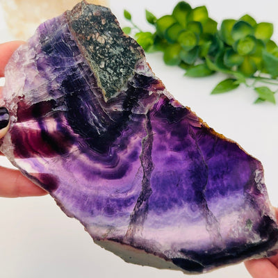 close up of the details on this fluorite semi polished crystal slab 