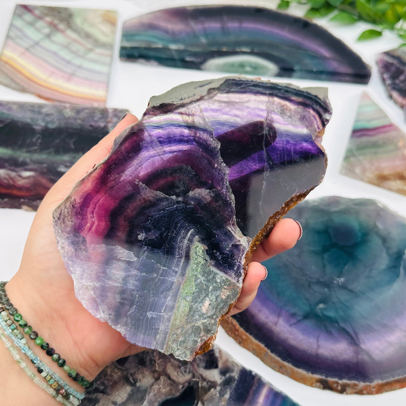 semi polished crystal slab in hand for size reference 