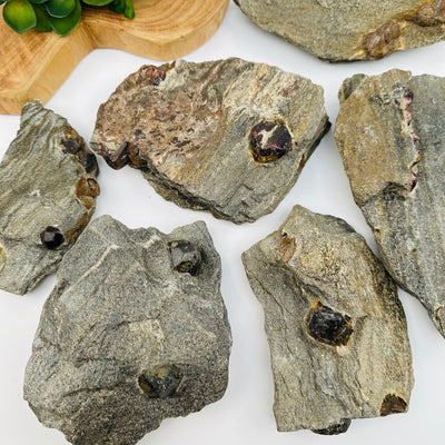 multiple crystals displayed to show the differences in the sizes and color shades 