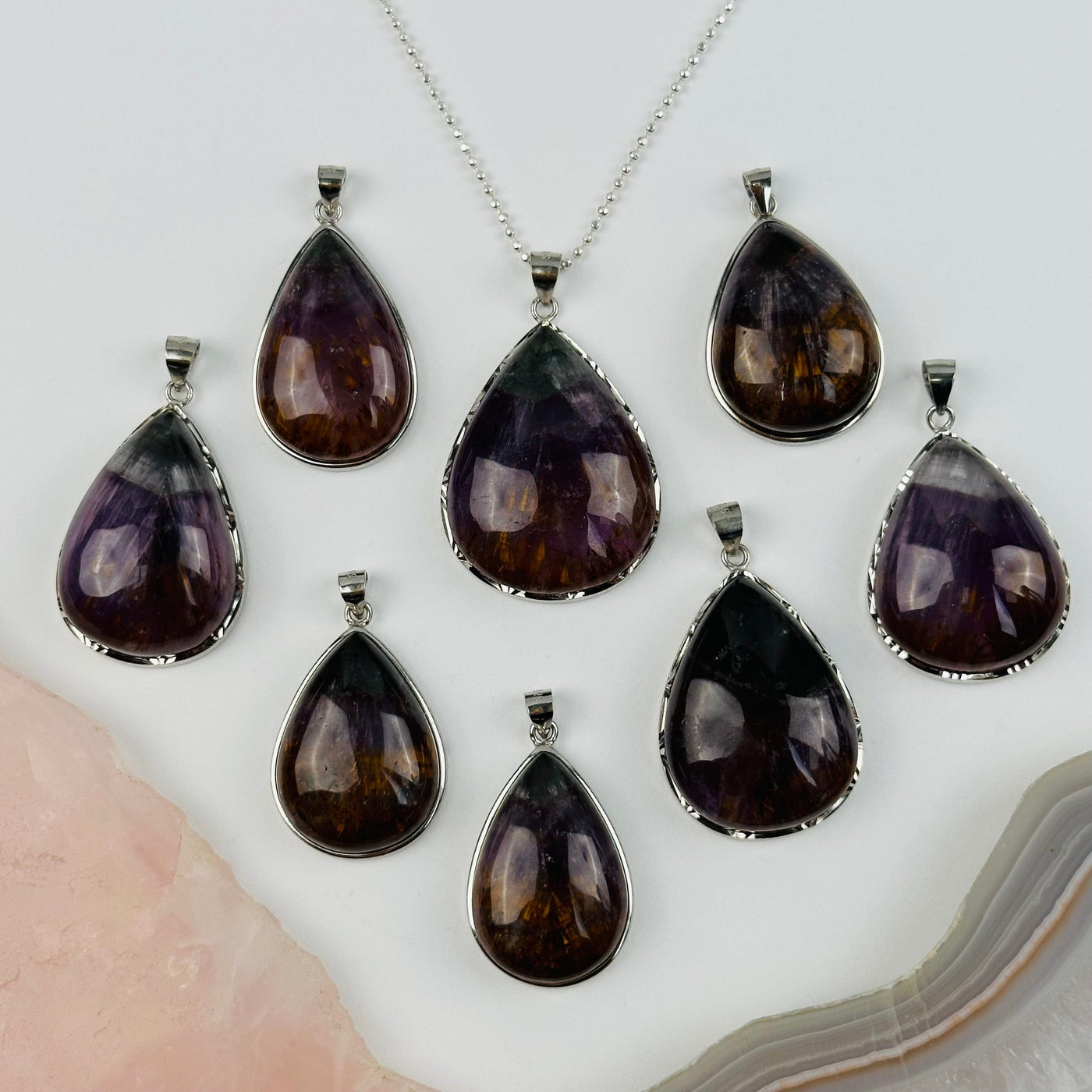 multiple pendants displayed to show the differences in the sizes 