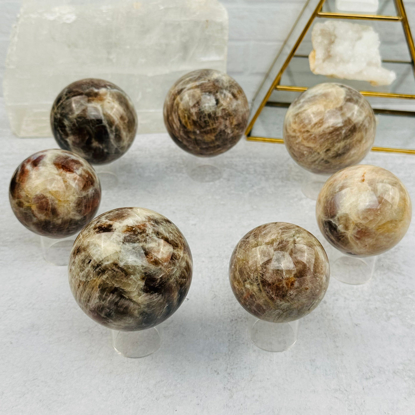 multiple spheres displayed to show the differences in the sizes and color shades 