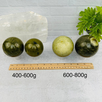 Green Jade Polished Spheres - BY WEIGHT - next to a ruler for size reference