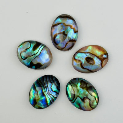 multiple cabochons displayed to show the differences in the color shades 