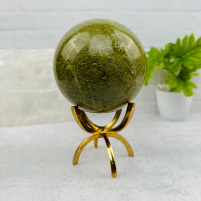 Green Jade Polished Sphere displayed as home decor
