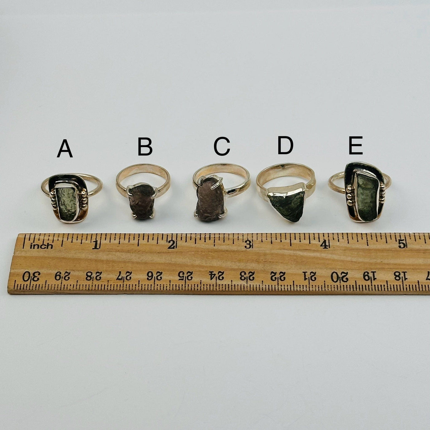 rings next to a ruler for size reference 