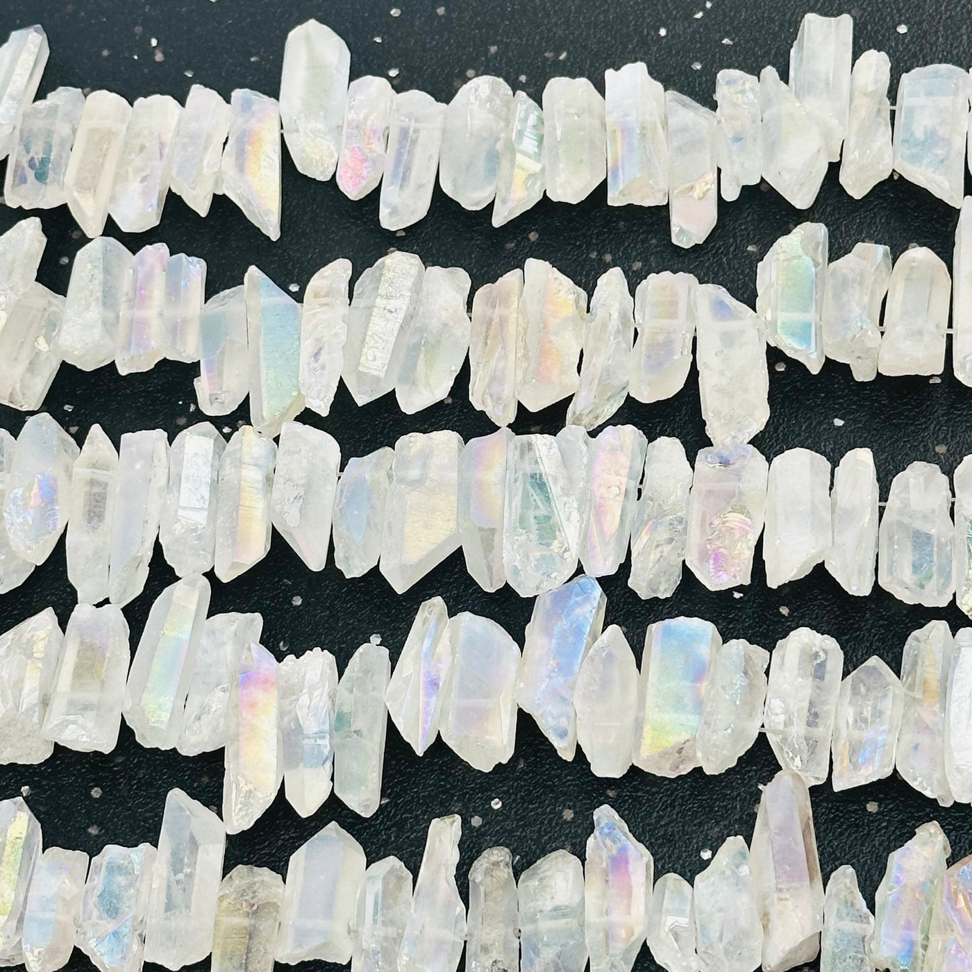 multiple crystal bead strands displayed to show the differences in the sizes and color shades