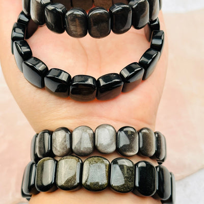 close up of the details on these sheen obsidian bracelets 
