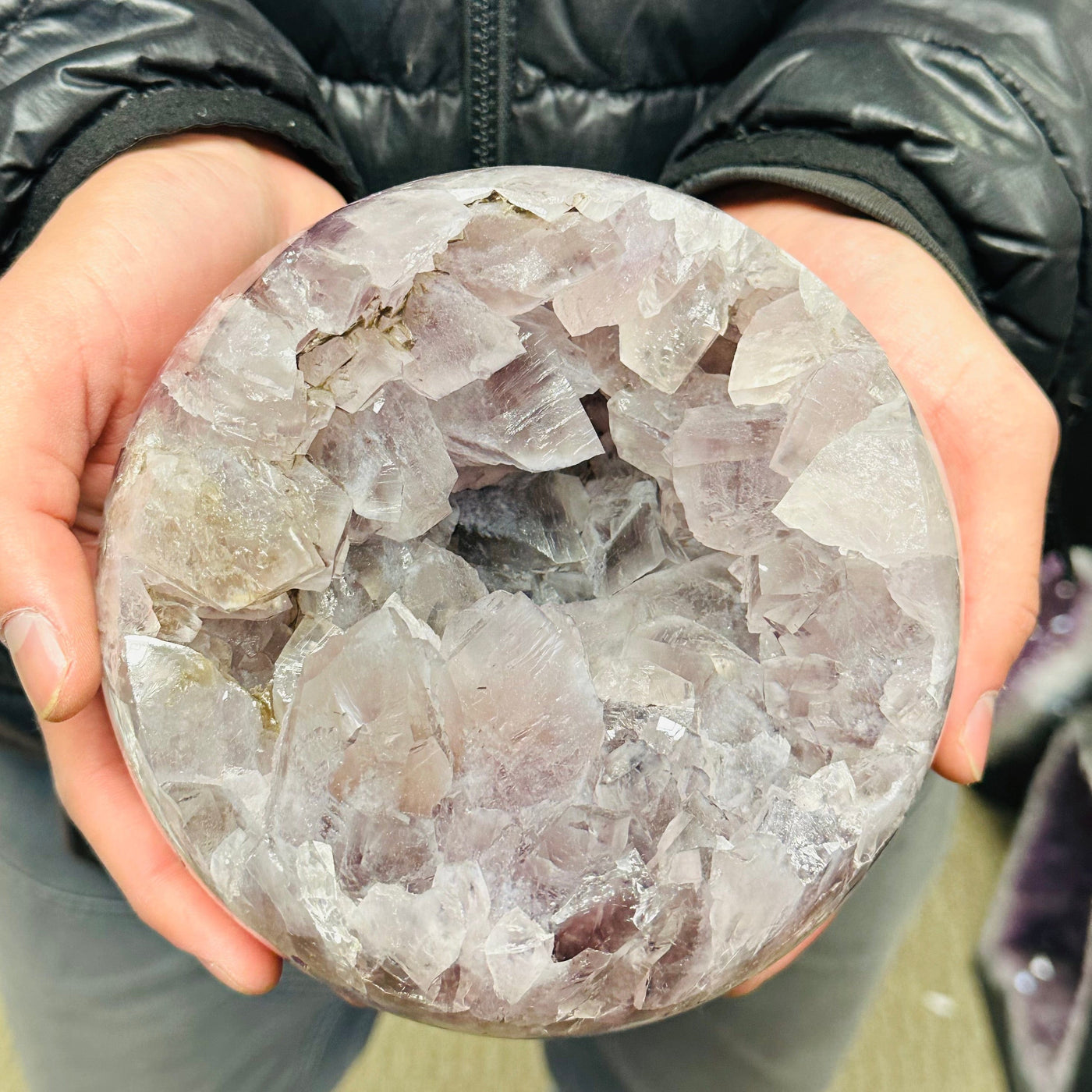 large amethyst sphere in hand for size reference 