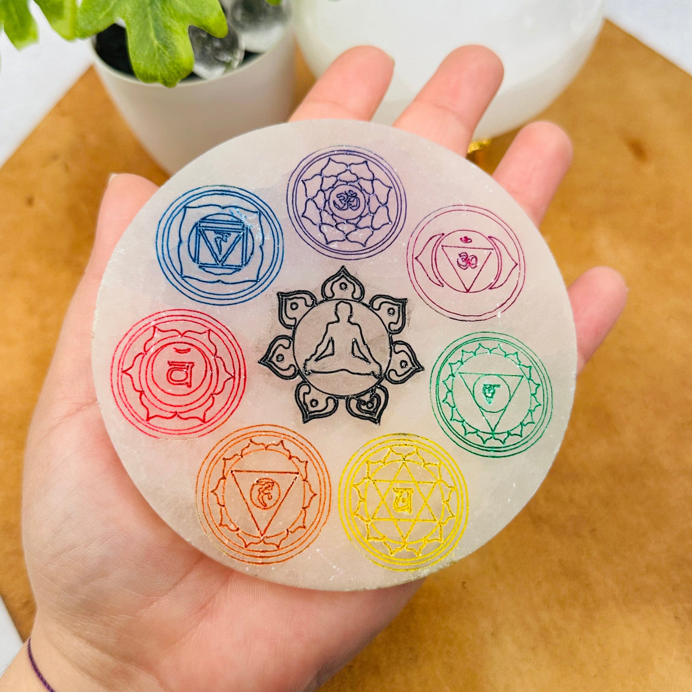 Selenite Charging Plate - Engraved Colorful Chakra - 10cm - in hand for size reference 