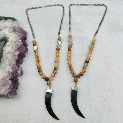necklaces displayed to show the slight differences in the sizes and color shades 
