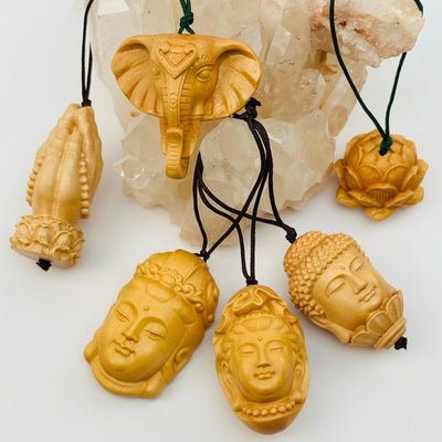 multiple wooden charms displayed to show the differences in the sizes 