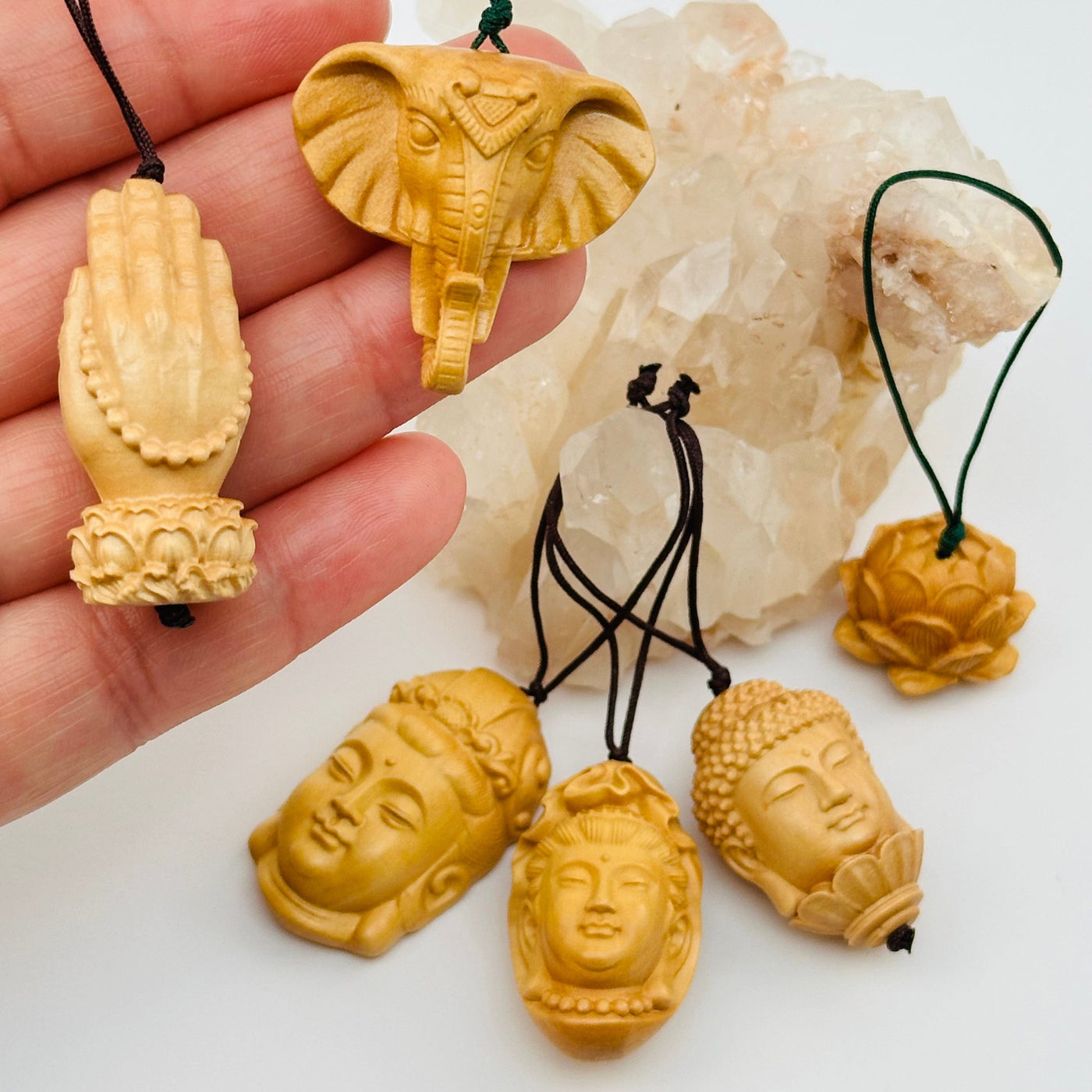multiple wooden charms displayed to show the differences in the styles