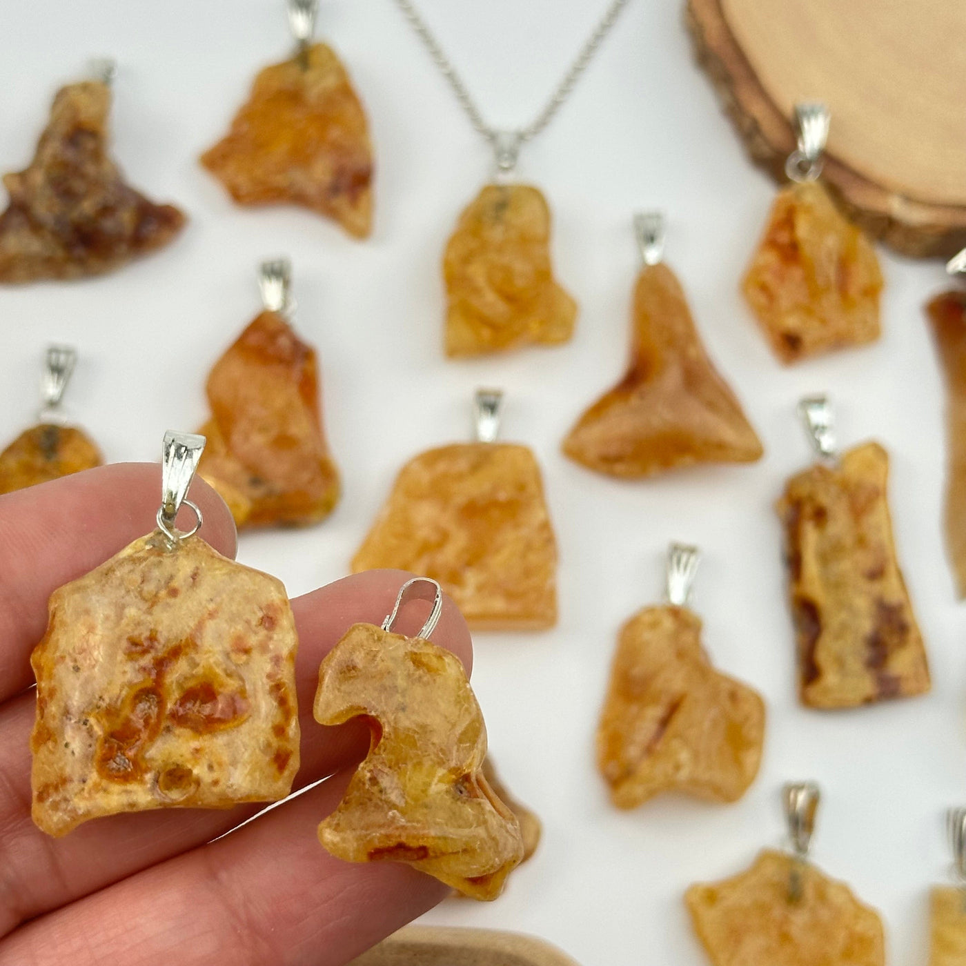 close up of the details on these amber pendants