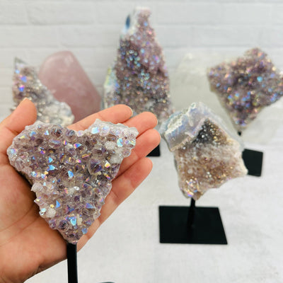 Amethyst Druzy Crystal with Angel Aura Pearly Finish on metal stand on hand for size reference 
