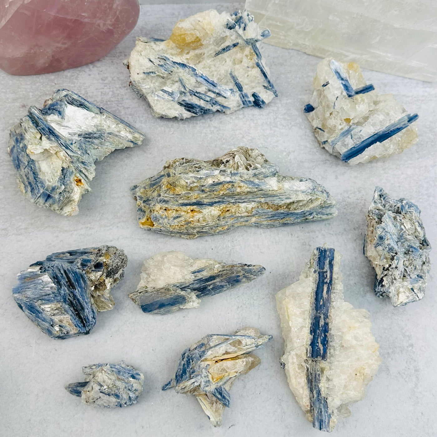 multiple kyanite crystals displayed to show the differences in the sizes and color shades 