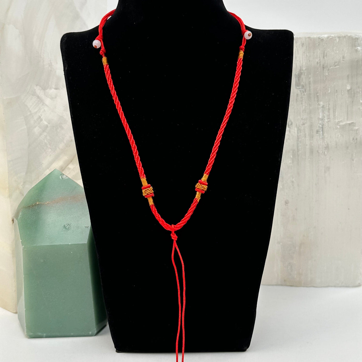 necklace displayed to show how it hangs. available with a gold knot
