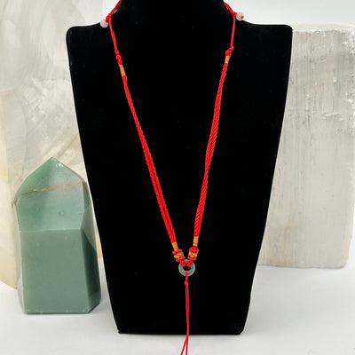 necklace displayed to show how it hangs. available with a green jade bead