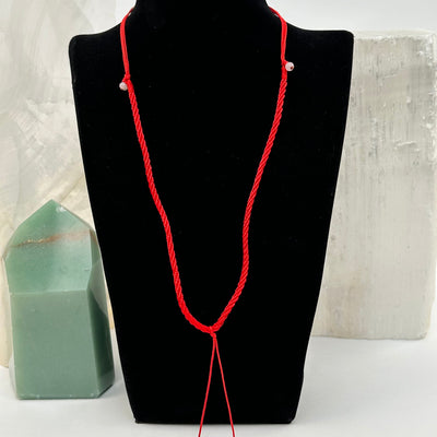 necklace displayed to show how it hangs.