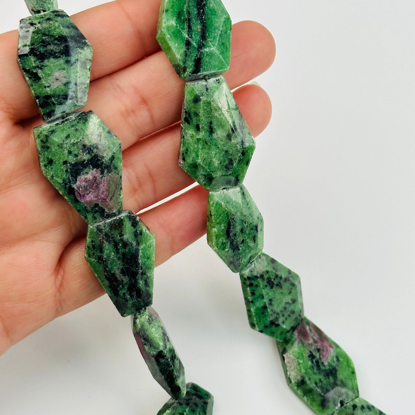 Ruby Zoisite Crystal Bead - 1 full strand in hand for size reference 