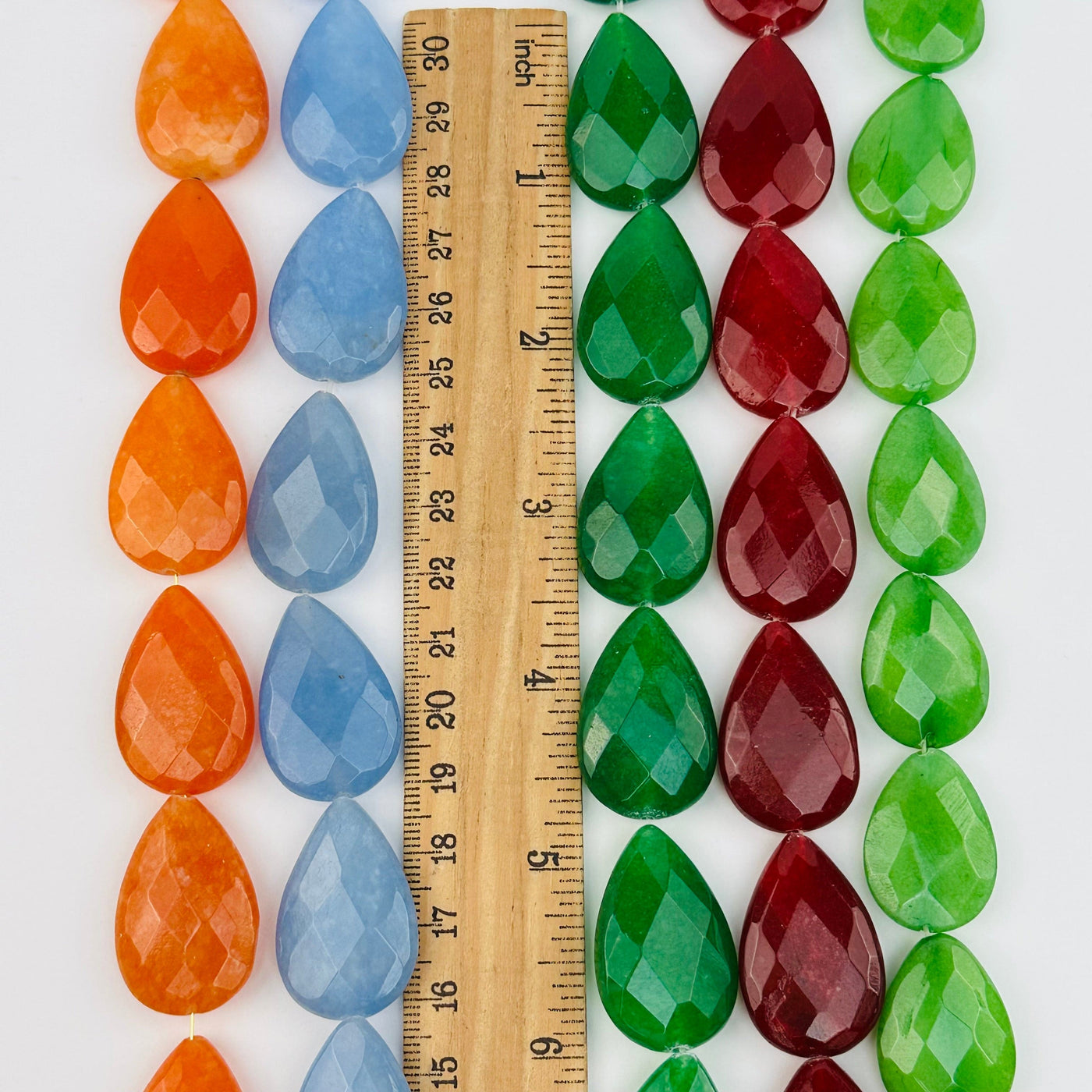 beads next to a ruler for size reference 