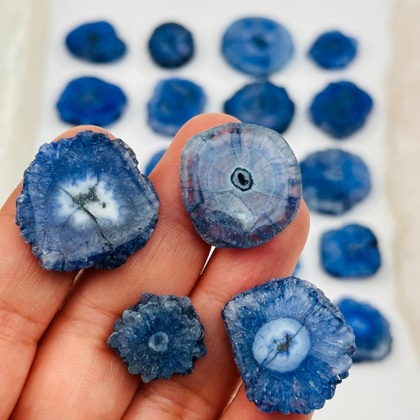 close up of the details on these blue solar quartz cabochons 