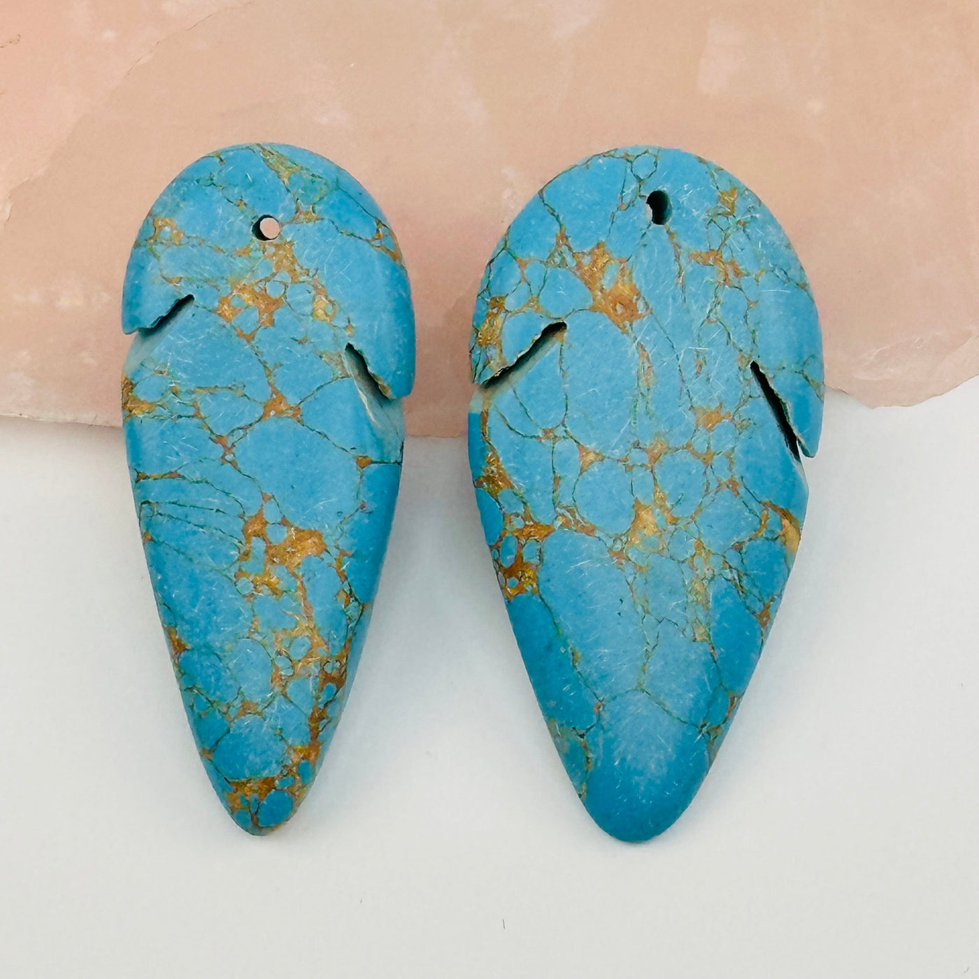 close up of the details on there turquoise arrowhead bead