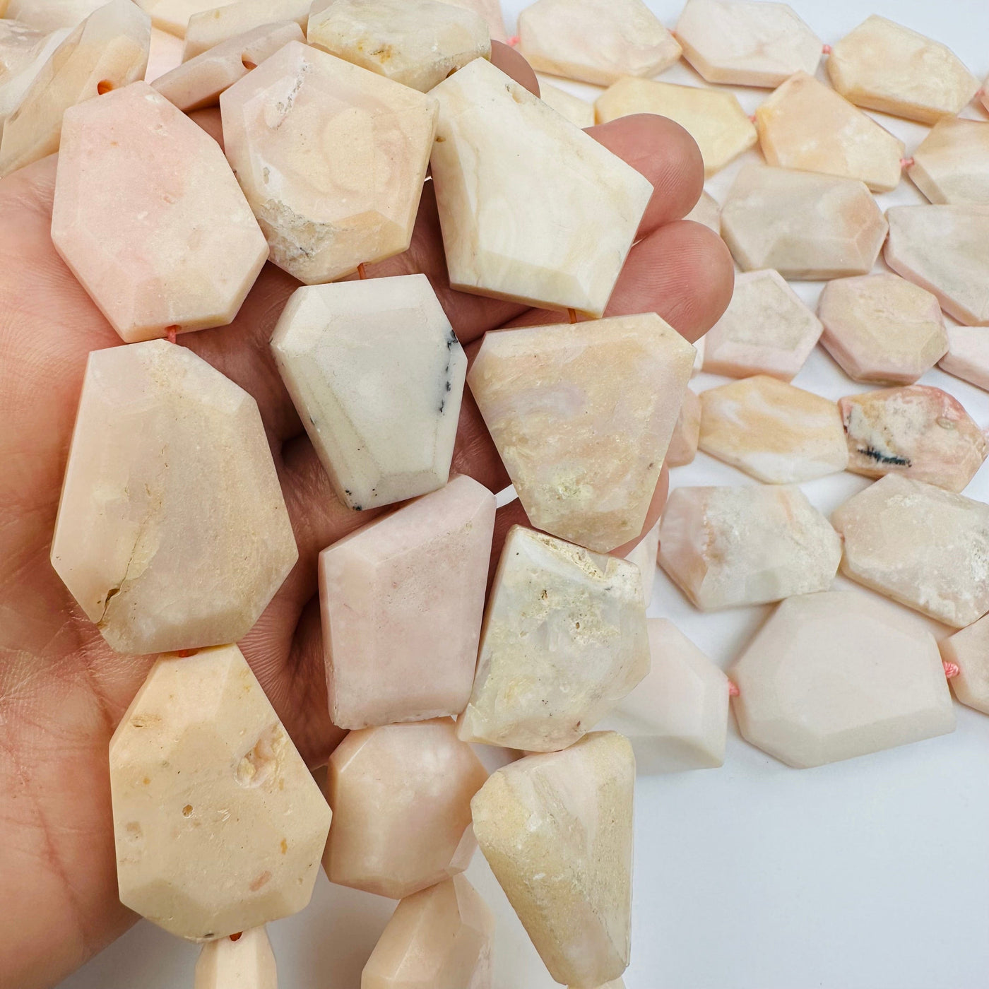 Pink Opal Crystal Beads - 1 Full Strand in hand for size reference 
