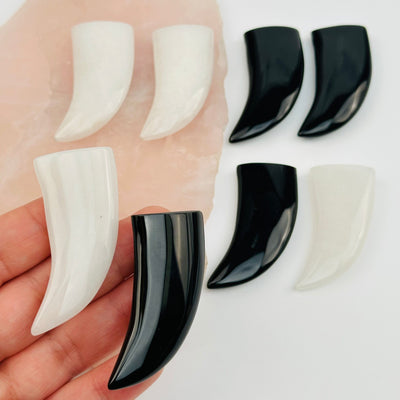 multiple crystal horn beads in hand for size reference 