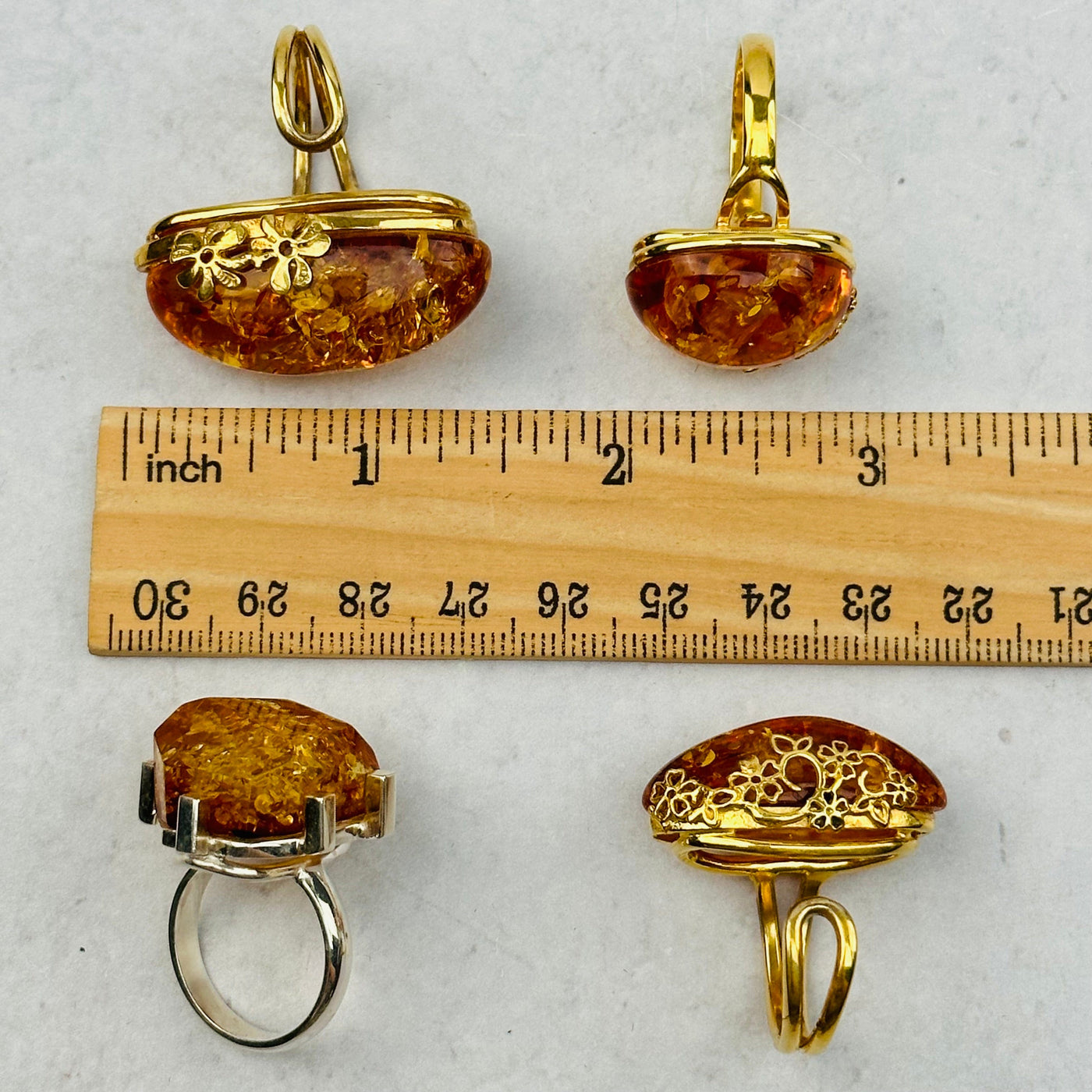 amber rings next to a ruler for size reference 