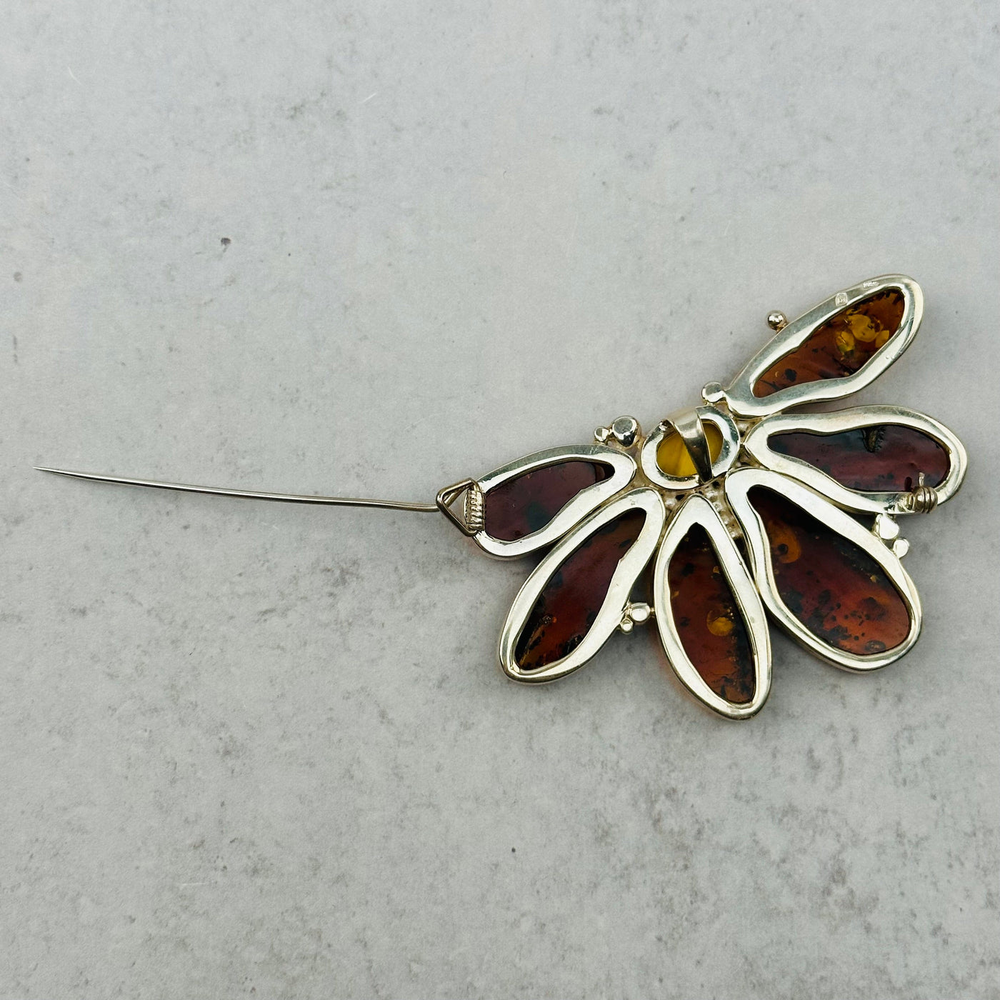 amber pendant is also a broche that can be pinned on to your favorite outfit 
