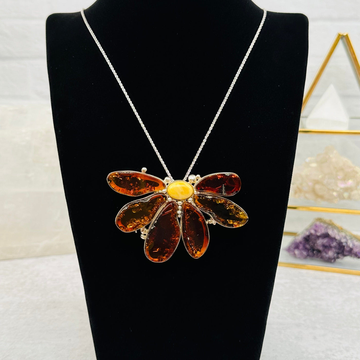 amber flower displayed as a necklace 