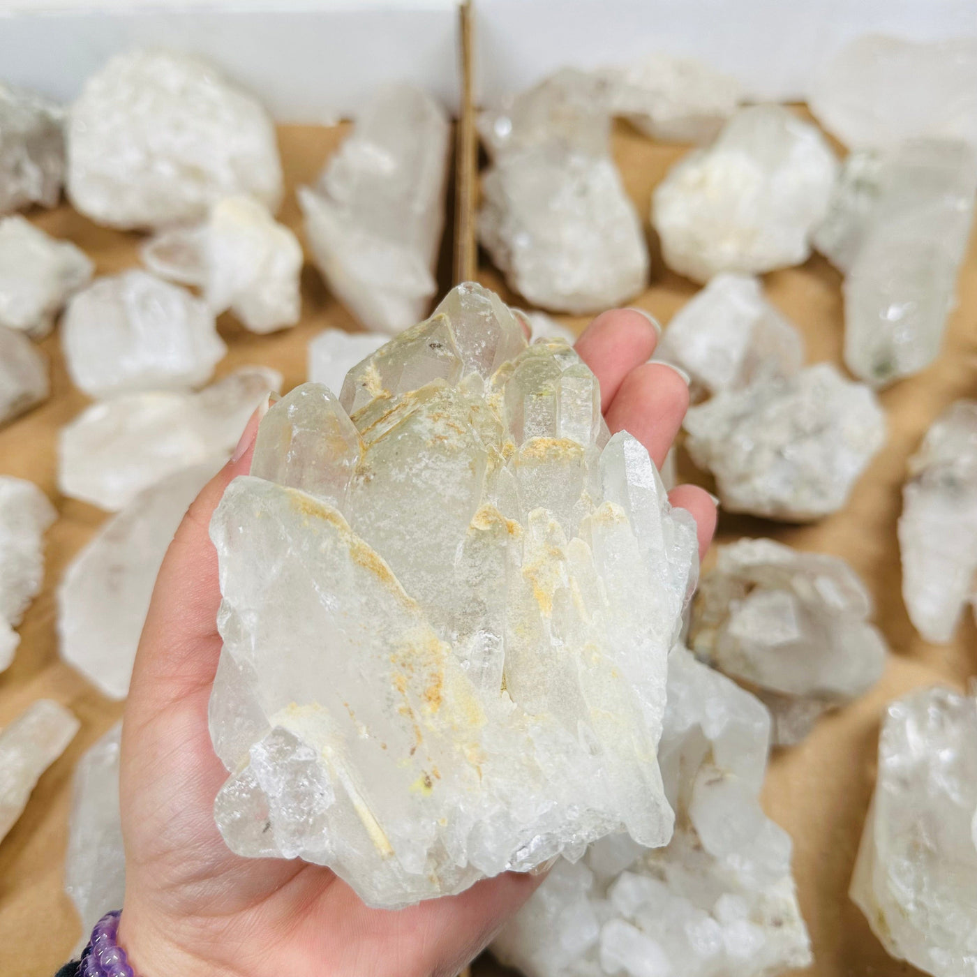 Natural Crystal Quartz Free Form Cluster in hand for size reference 