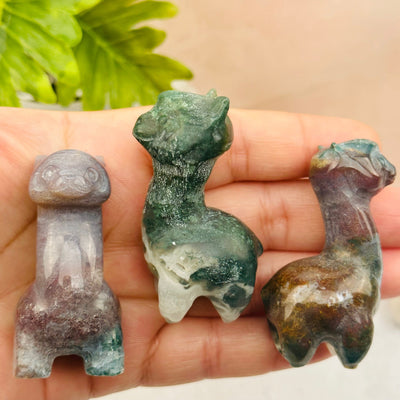Carved Gemstone Alpaca in hand for size reference 
