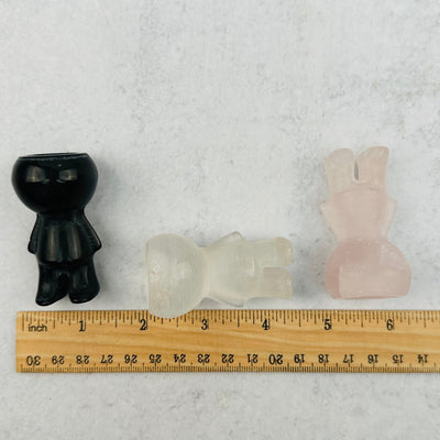 Carved Gemstone Mini Plant Holders next to a ruler for size reference 