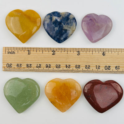 hearts next to a ruler for size reference 