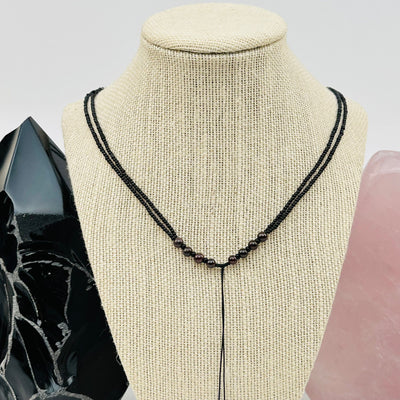 garnet necklace displayed to show how it hangs 