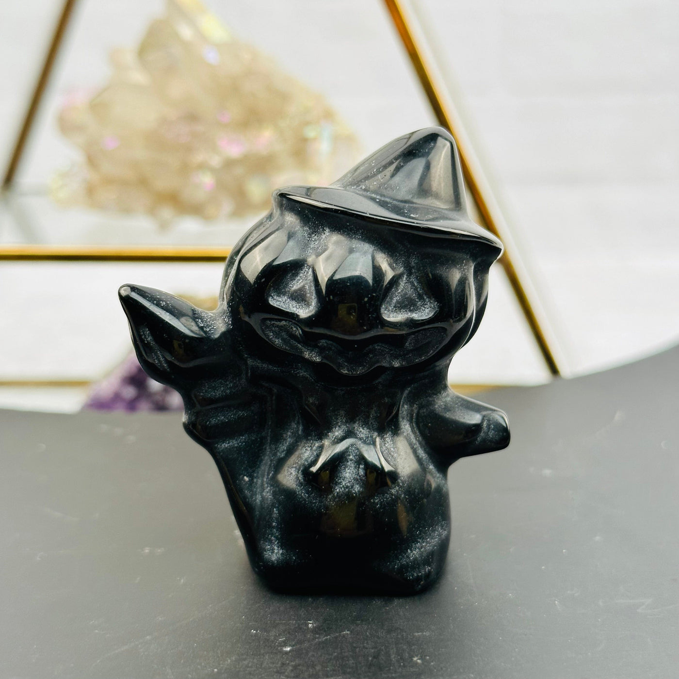 Carved Gemstone Pumpkin Head Witch displayed as home decor 