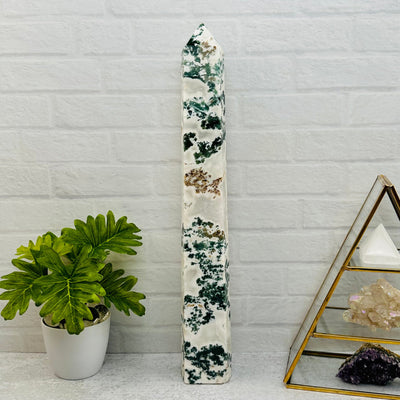 Moss Agate Tower Point displayed as home decor 