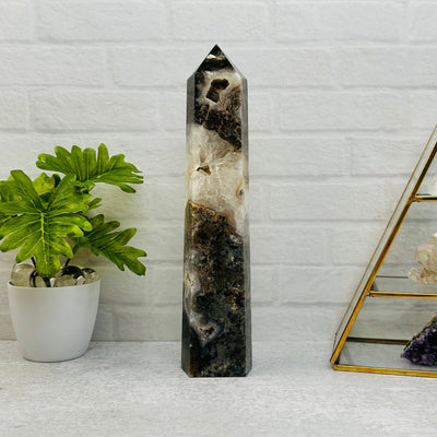 Moss Agate Tower Point displayed as home decor 