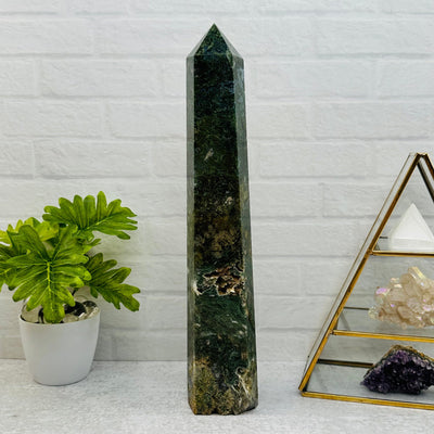 Moss Agate Tower Point displayed as home decor 